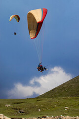 Paragliding over the clouds sunset view at Bir Billing Himachal Pradesh India. Clouds in the sky