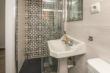 Contemporary shower with a 120 cm resin tray, folding screen, and designer taps with a matte black...