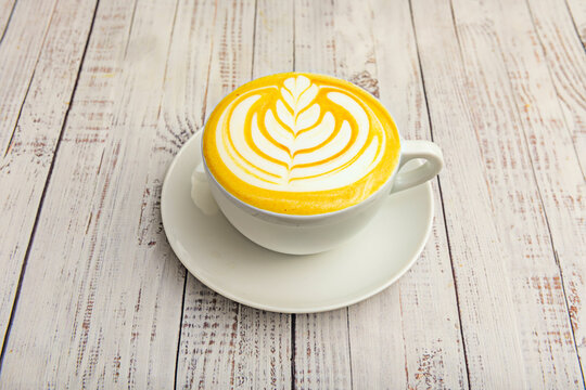 Classic latte served in a large breakfast mug with creamy foam and the aroma of freshly ground coffee