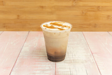  Dark chocolate iced latte with robust espresso, organic whole milk, and pure cacao syrup, garnished with chocolate shavings
