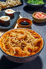 Ramen is a noodle dish served in a flavorful broth, complemented by various ingredients