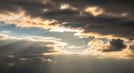 Fototapeta premium Golden sunbeams bursting through dramatic, dark storm clouds, symbolizing hope and divine light
