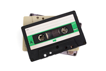 Old transparent compact vintage audio. Cassette tapes stacked isolated on white background.