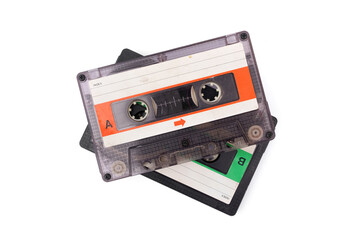 Old transparent compact vintage audio. Cassette tapes stacked isolated on white background.