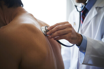 A doctor examines his patient.