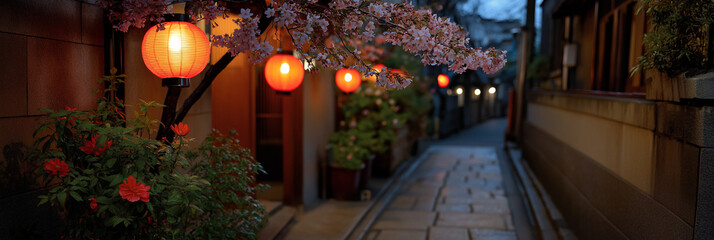 A mesmerizing night scene showcases cherry blossom trees illuminated by lanterns in a picturesque lane, inviting serenity and tranquility in a cultural setting.