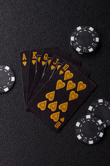 Obraz premium Playing card game poker in casino with chips, bets and risk. Cards and chips on black felt