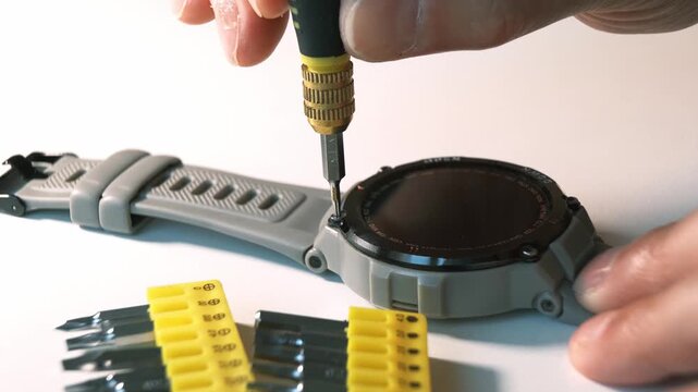 The Watch Repair Process uses specialized tools and a magnifying glass for precision