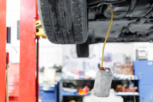 Car service, closeup process changing brake fluid. - Powered by Adobe