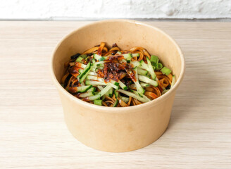 Savor flavorful sesame noodles with refreshing cucumber. Perfect for takeout menus, food blogs, or showcasing delicious, convenient meal options.