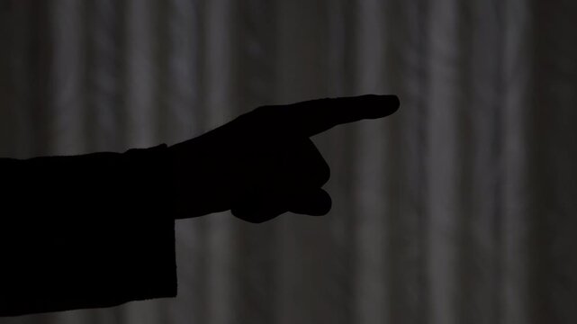 Hand gesture in silhouette showing precise guidance.