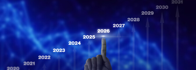Impending Business Growth Graph Chart with Escalating Trend and Hand Directing To The Year 2026 Emphasizing Advancement and Financial Design On Blue