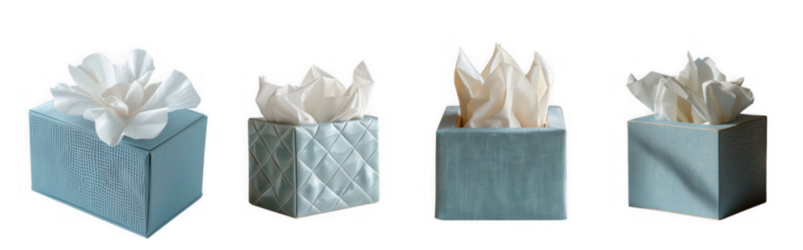 Four decorative tissue box covers with white tissues emerging from the top, isolated on transparent background