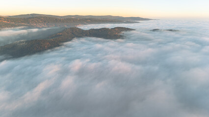 Obraz premium Golden evening fog covering Bavarian hills and valleys aerial view of calm autumn landscape in southern Germany
