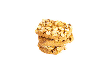 Peanut cookie in a stack on the white background. Delicious looking peanuts over the cookie in golden color