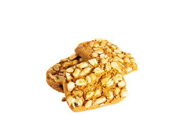 Peanut cookie in a stack on the white background. Delicious looking peanuts over the cookie in golden color