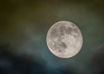 shiny bright full moon shining in the night sky