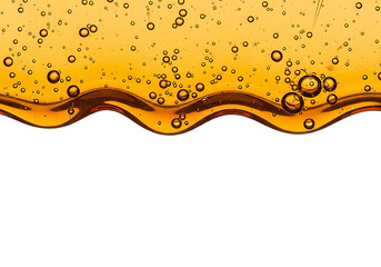 Close up of golden liquid with many small bubbles and wavy surface isolated on transparent background