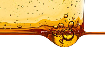 Close up macro shot of viscous golden honey with air bubbles dripping from a surface isolated on transparent background