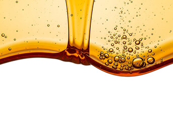 Golden amber liquid pouring and creating bubbles in a dynamic fluid motion isolated on transparent background