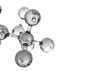 Close up of a metallic molecular structure with spherical atoms and connecting rods isolated on transparent background