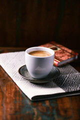 Cup of coffee on rustic wooden background. Soft focus. Copy space	
