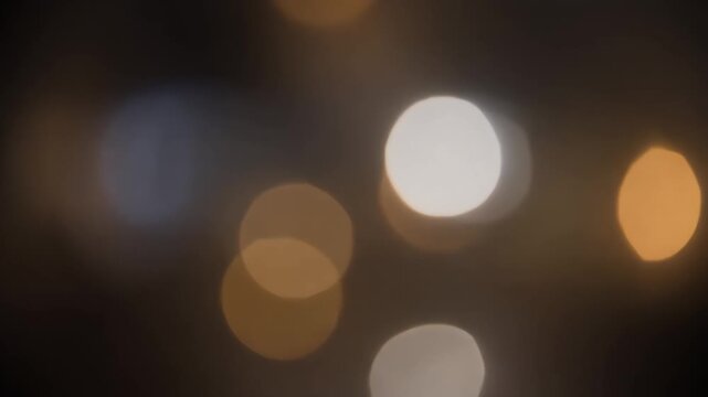 Timelapse of Bokeh Lights Slowly Moving Out of Focus and Then Refocusing into Clarity, Artistic Visuals, Seamless Loop Video for Creative Motion Graphics and Visual Effects