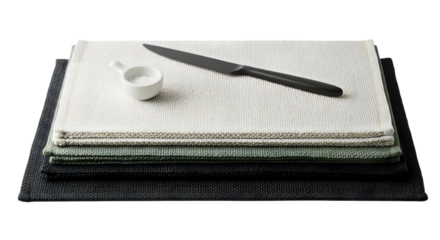 Stack of placemats isolated on transparent background with knife and salt cellar