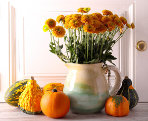 pumpkins and flowers, autumn, fall season still life