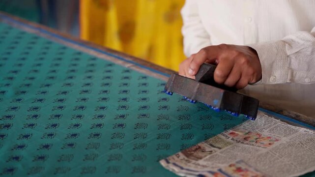 Close Shot of Hands Printing on Linen with Wooden Block in Workshop &mdash; Artisan Creating Traditional Handcrafted Textile Design, Block Printing Process, and Cultural Fabric Art in 4K Ultra HD