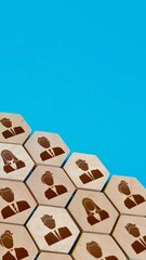 Honeycomb pattern of people icons against a bright blue background
