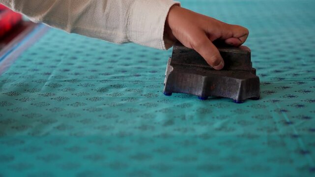 Close Shot of Hands Printing on Linen with Wooden Block in Workshop &mdash; Artisan Creating Traditional Handcrafted Textile Design, Block Printing Process, and Cultural Fabric Art in 4K Ultra HD