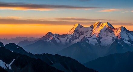 Snow capped mountain peaks bathed in golden sunrise light mountains summit