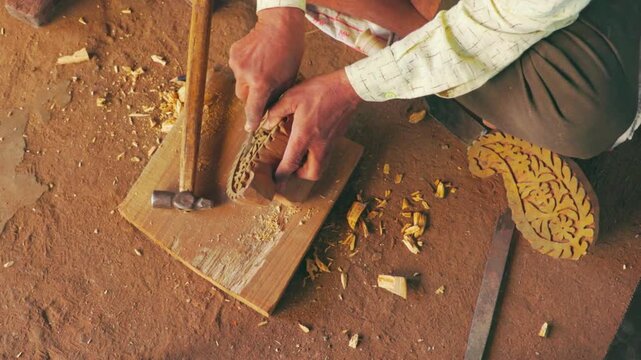 Close-Up of Man&rsquo;s Hands Carving Wooden Block for Block Printing &mdash; Artisan Crafting Traditional Handcrafted Design with Precision Tools, Wood Engraving Process and Cultural Art Form in 4K Ultra HD