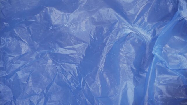 Abstract blue plastic texture animation &mdash; glossy crumpled surface