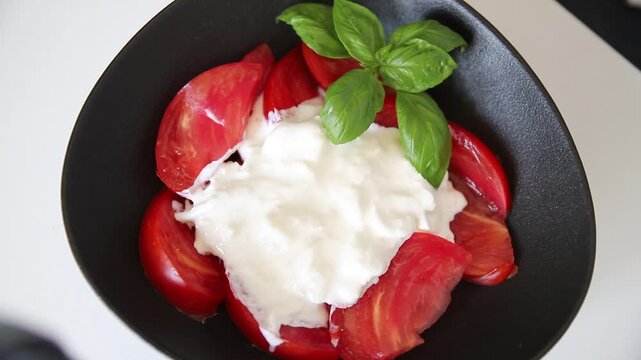 Salad strachatella and tomato portion size natural product tasty snack fresh delicious gourmet food background on the table rustic top view copy space keto and paleo diet