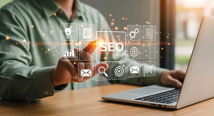 Person using a smartphone to interact with a digital interface displaying seo icons and data on a laptop