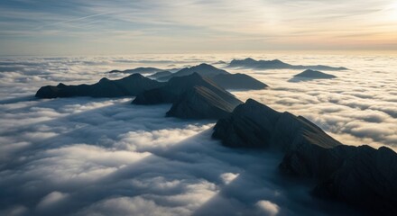 Majestic mountain peaks above a sea of clouds at sunrise. Aerial perspective of a vast landscape. Corporate concept for leadership vision and success. Reaching new heights and opportunity