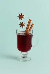 Mulled wine in glass with cinnamon and anise minimal