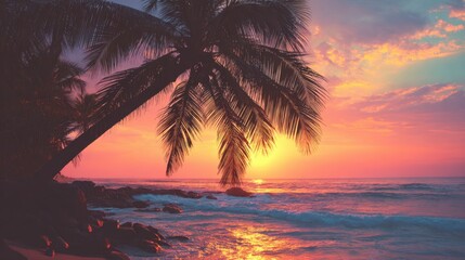 Obraz premium Sunset casts vibrant colors across the sky and ocean, creating a serene atmosphere. Palm trees frame the scene as gentle waves lap at the shore, inviting peace and reflection.
