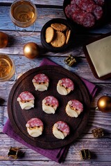 Salami sausage and cheese slices and crackers in the form of Santa Claus for Christmas holidays