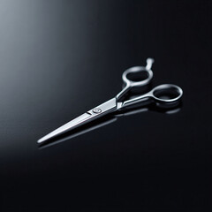 Obraz premium Sleek, silver scissors on a dark surface. Represents precision, skill, and style. Ideal for beauty, fashion, or creative concepts. Clean and modern aesthetic.