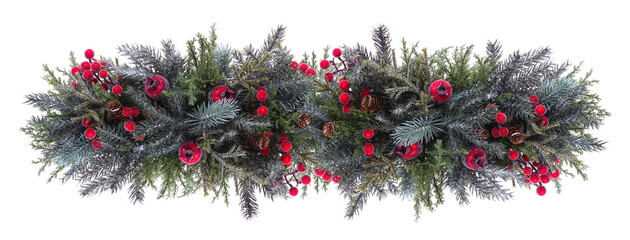 Christmas banner of snowy branches and red berry decorations. Top view isolated on a white background. © Jenifoto