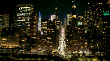 Panoramic view of a dense city skyline at night. Thousands of windows glow with light, creating a mesmerizing pattern. Ideal for marketing, technology, or business themes.