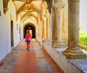 Woman walking inside of an old building