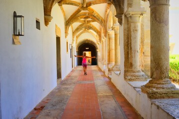 Woman walking inside of an old building