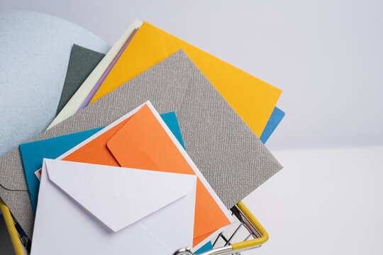 Paper envelopes on a light background. New mail, write a message. Send and receive mail. Postal delivery service. Empty envelope, empty space. Communication with people, paperwork