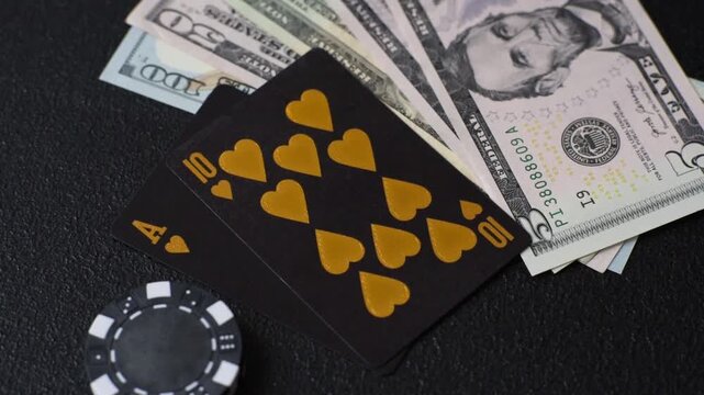 Playing blackjack or baccarat card game in casino with chips, bets and risk. Cards and chips on black felt as background for your design