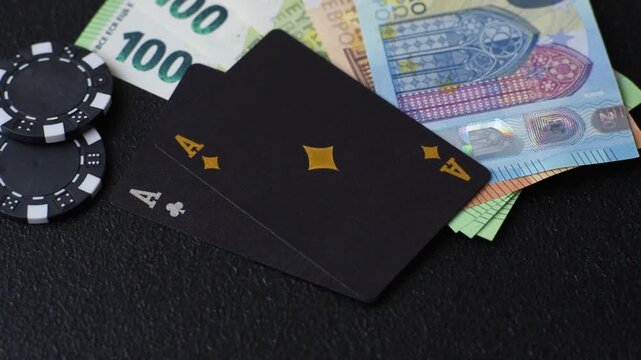 Playing blackjack or baccarat card game in casino with chips, bets and risk. Cards and chips on black felt as background for your design