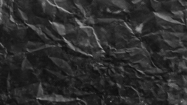 black paper crumpled texture animation, background video and copy space for advertising elements,4k  stock footage 20 seconds long, stop motion background video